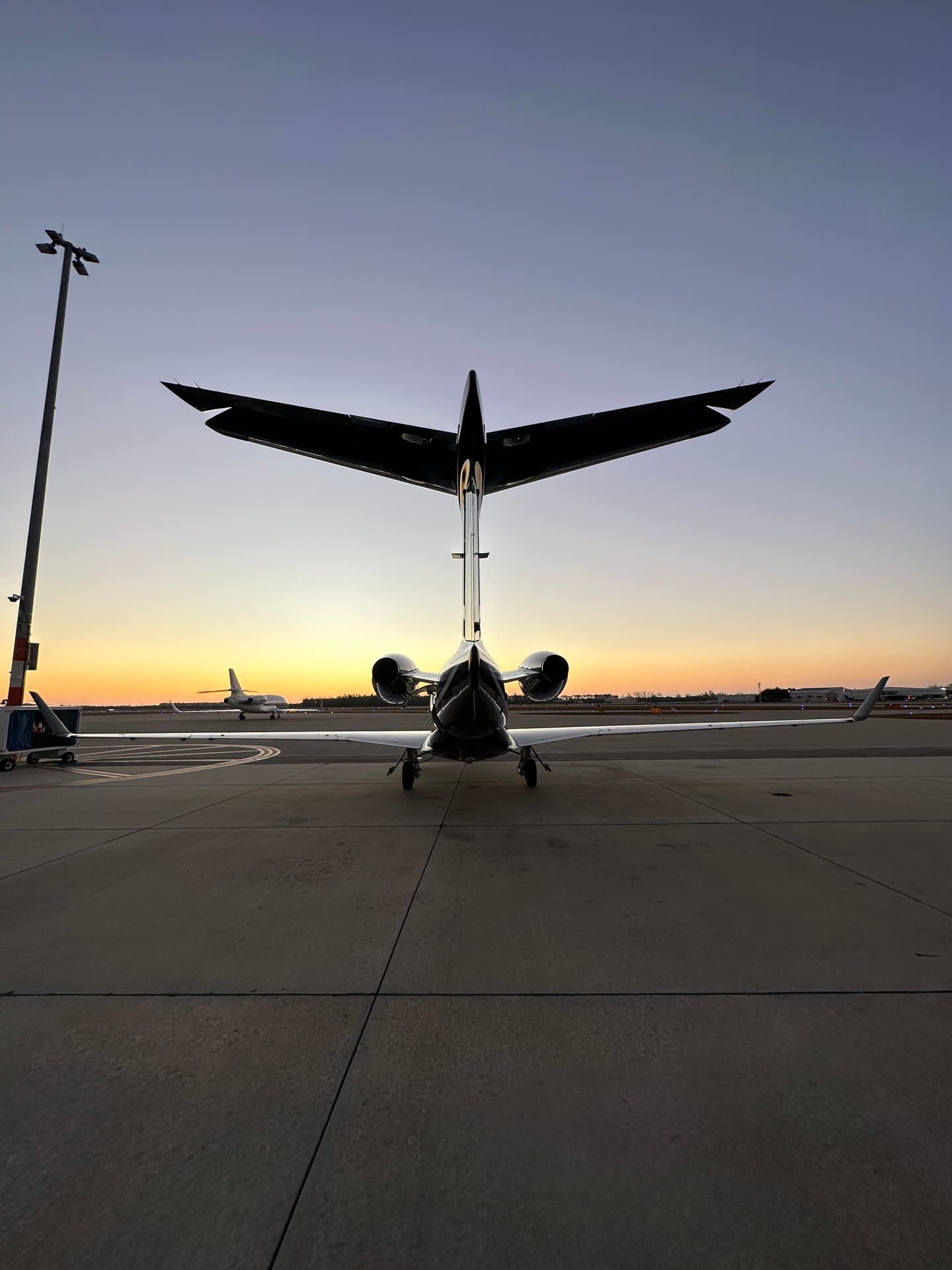 Embraer Phenom 300 on the ramp at sunset